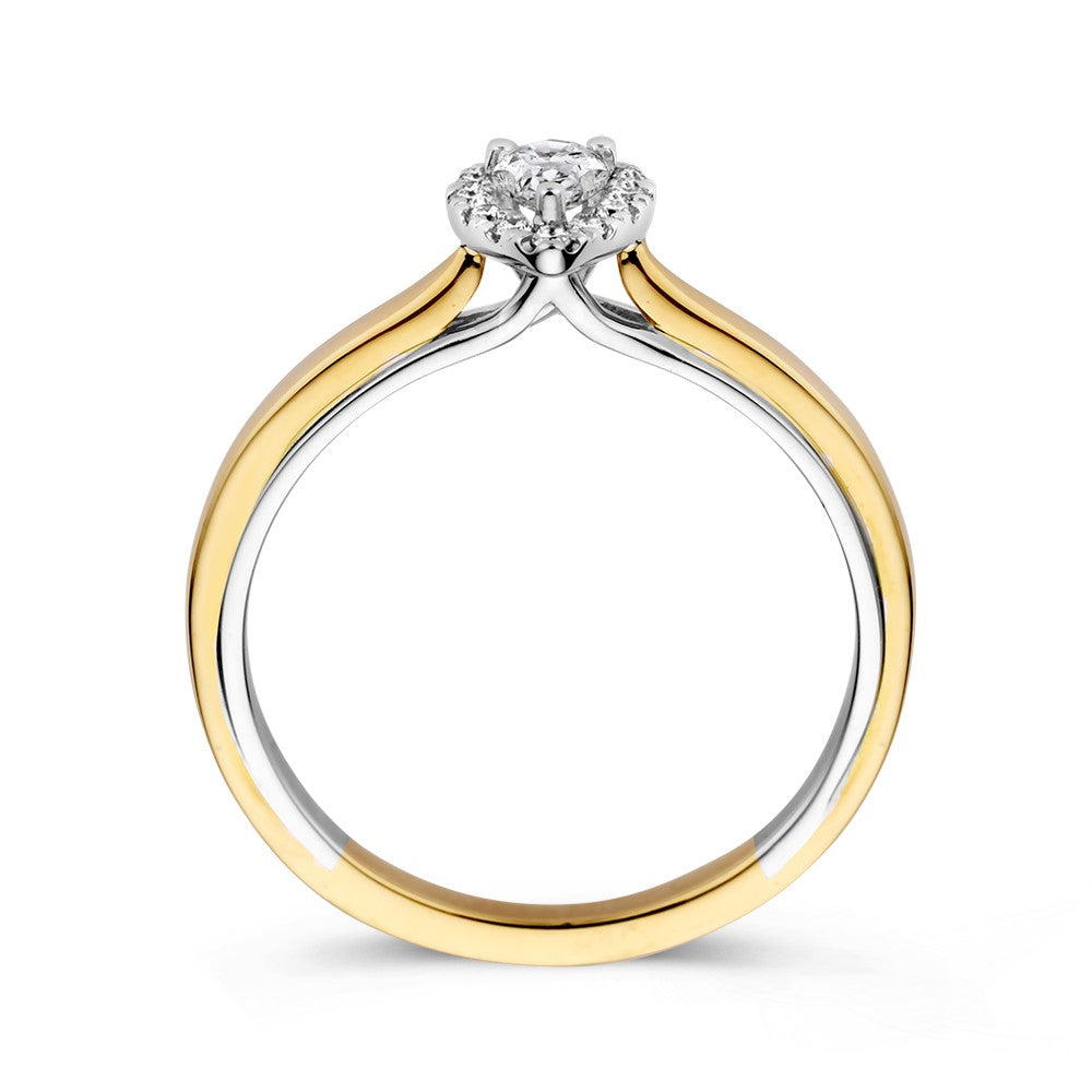 Bague en or bicolore 14k avec diamant en forme de poire dans un sertissage entourage