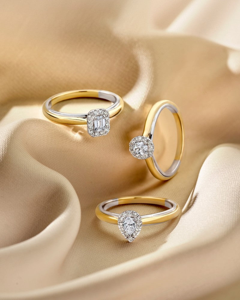Bague en or bicolore 14k avec diamant en forme de poire dans un sertissage entourage
