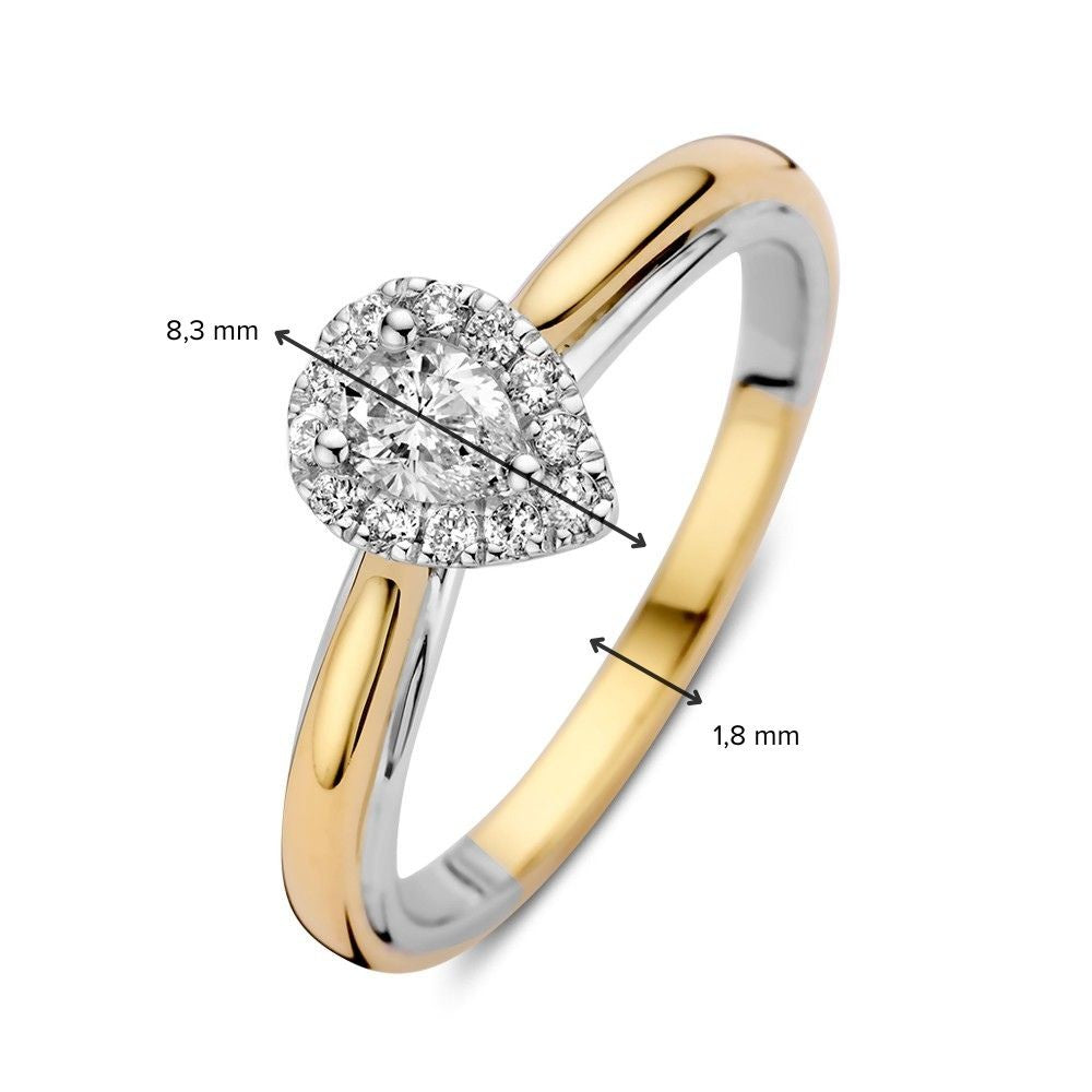 Bague en or bicolore 14k avec diamant en forme de poire dans un sertissage entourage