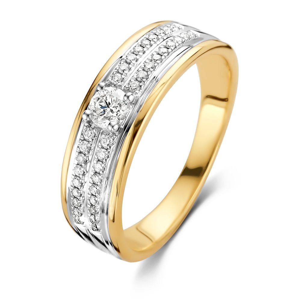 Bague bicolore en or avec un centre en diamant brillant de 0,34 ct.