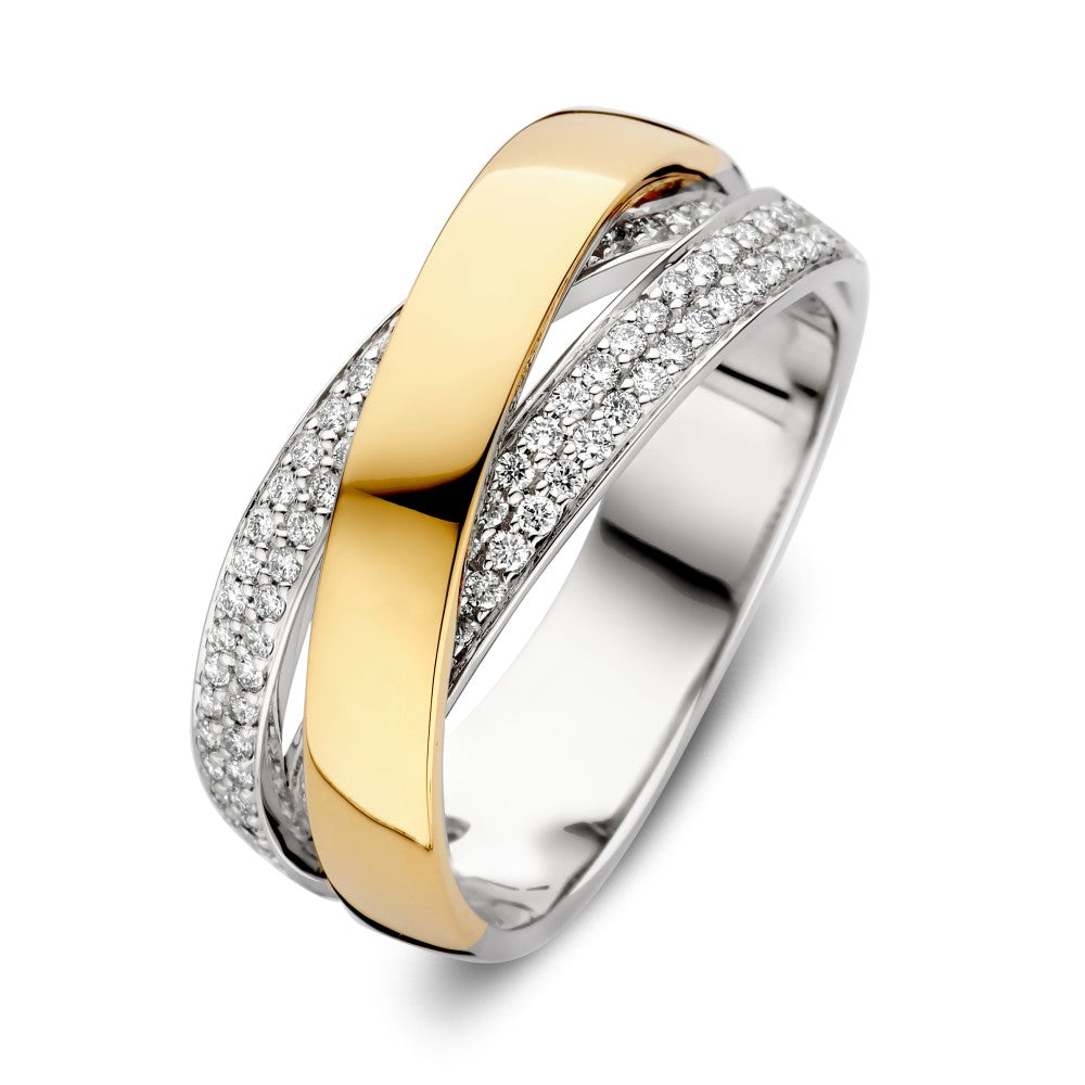 Bague bicolore en or et argent avec un diamant brillant de 0,37 ct.