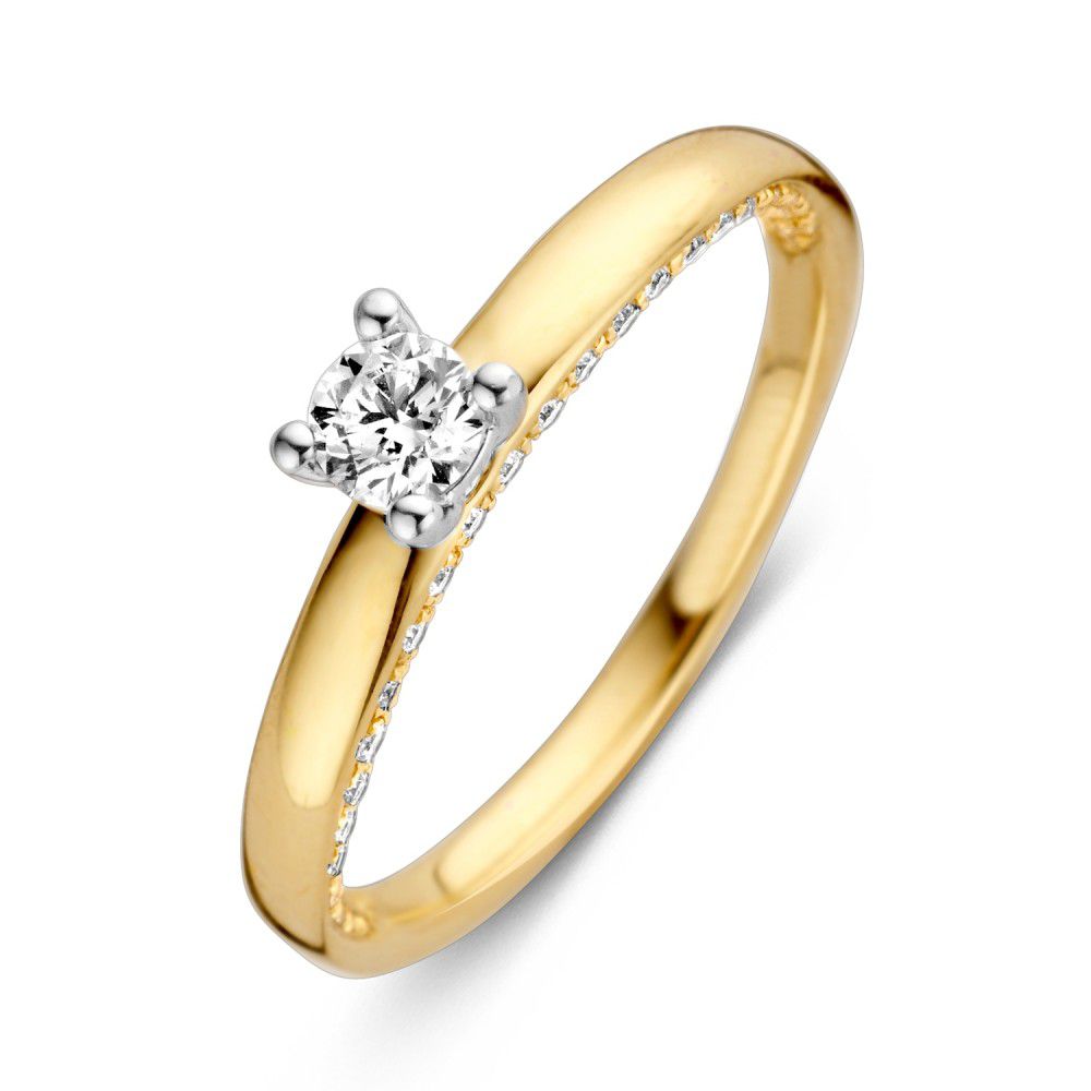 Bague bicolore en or avec un brillant de 0,44 ct et des petites pierres sur le côté.