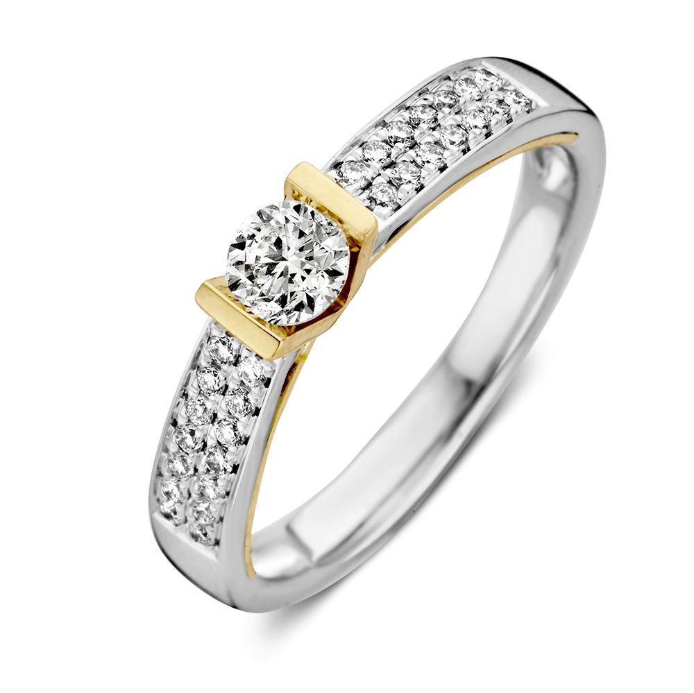 Bague bicolore en or blanc et or jaune avec un diamant brillant de 0,30 crt.