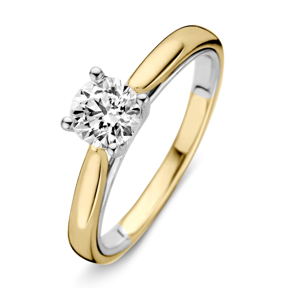 Bague bicolore en or jaune et blanc avec un diamant brillant de 0,74 ct H/SI-1 en or 14 carats.