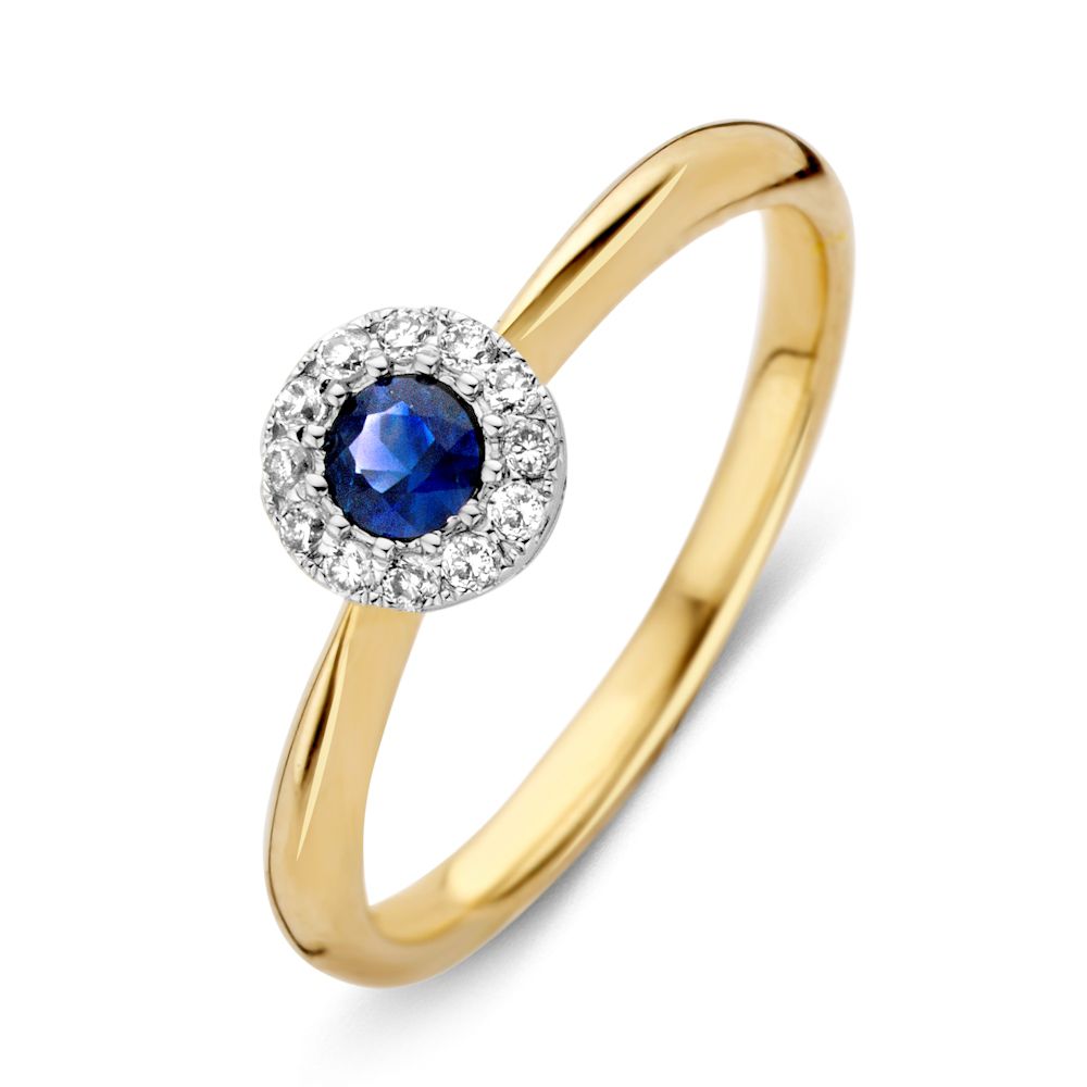 Bague en or 14 carats avec saphir bleu et diamants.