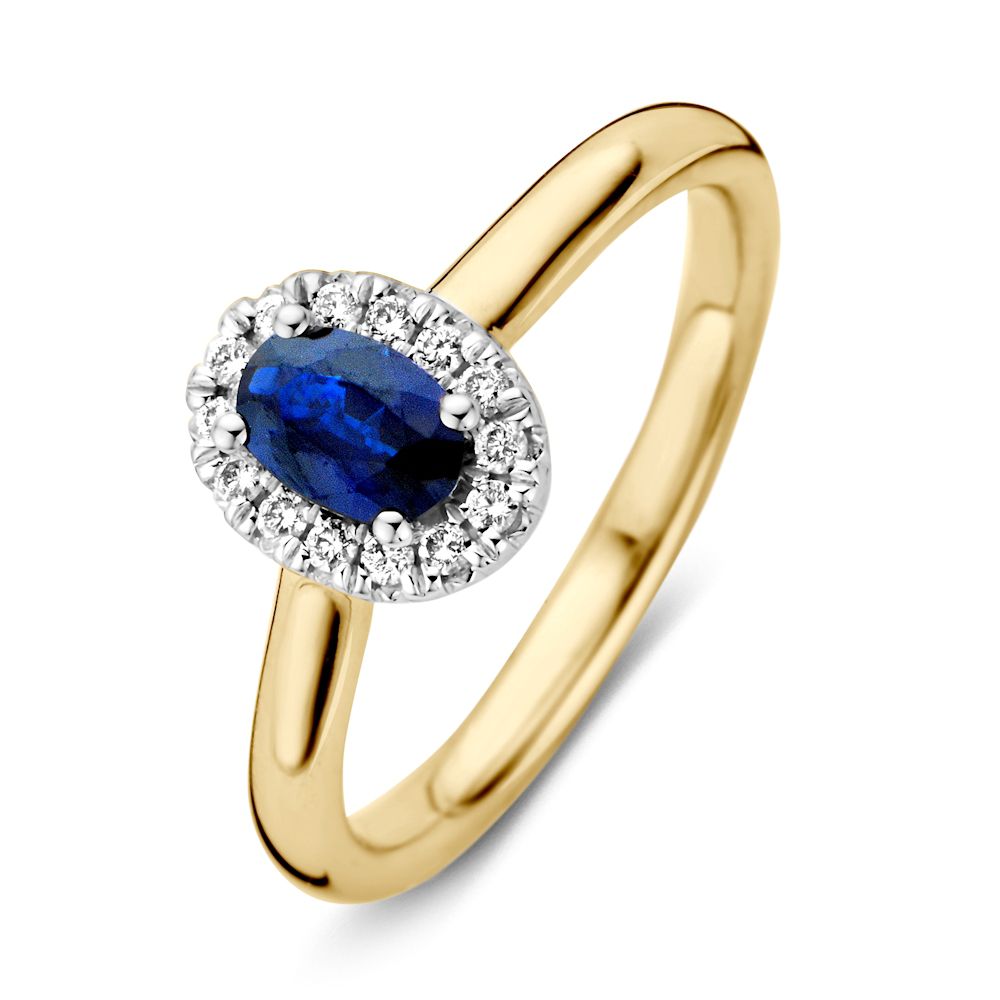 Bague en or 14 carats avec saphir bleu et halo de diamants.