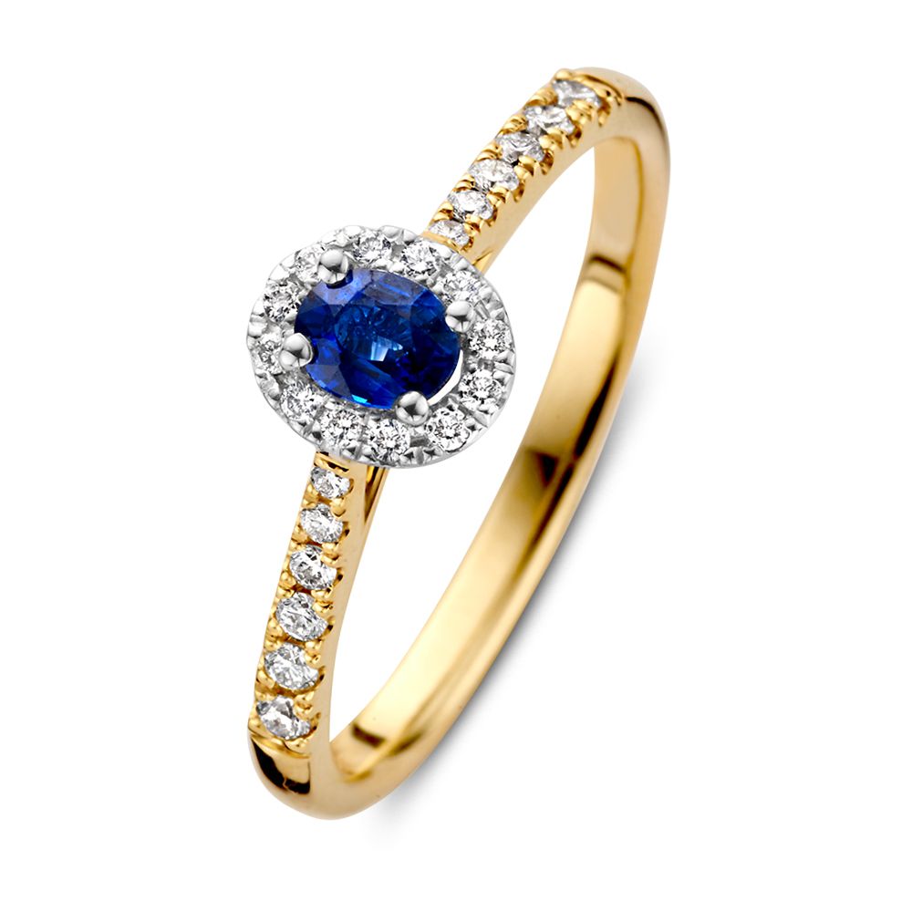 Bague en or bicolore 14 carats avec saphir ovale bleu et halo de diamants.