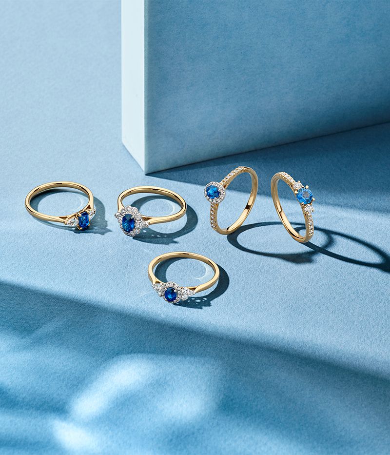 Bague pour femme en or bicolore 14 carats avec saphir ovale bleu et halo de diamants