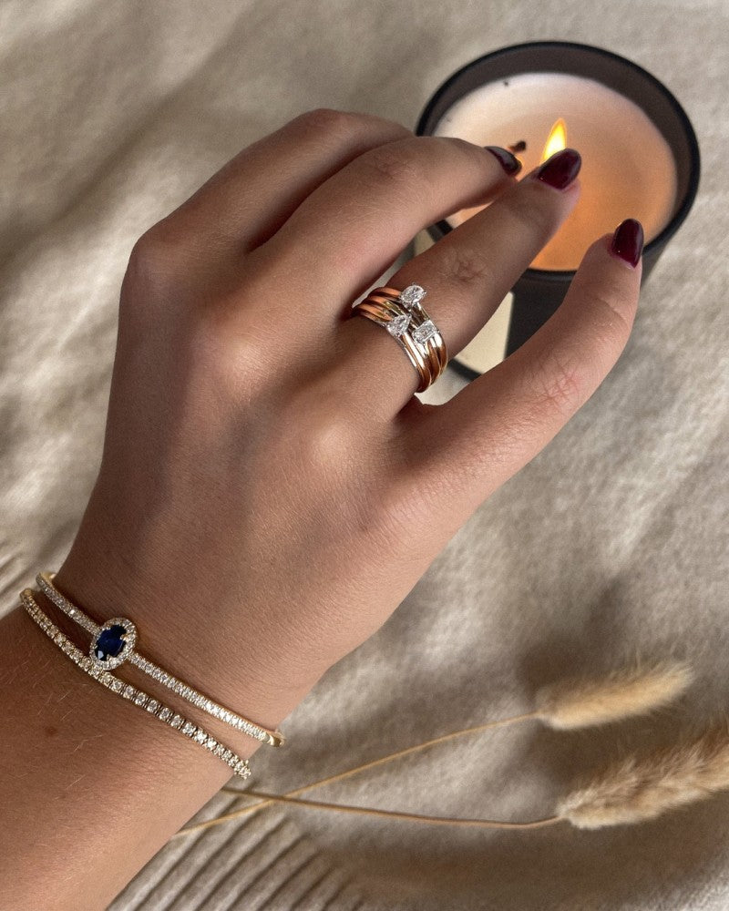 Bague en or bicolore 14k avec diamant en forme de poire 0.23ct