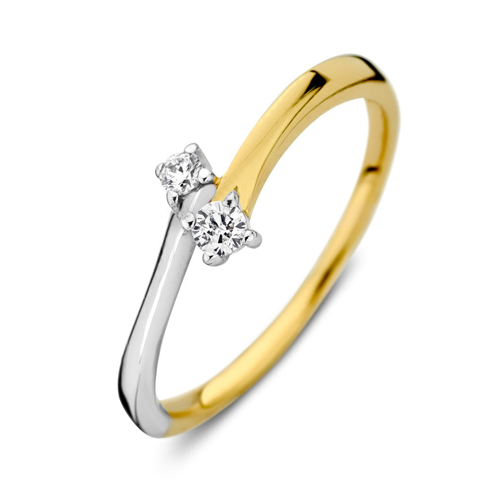 Bague en or bicolore avec deux zirkonia, une partie en or jaune et une en or blanc.