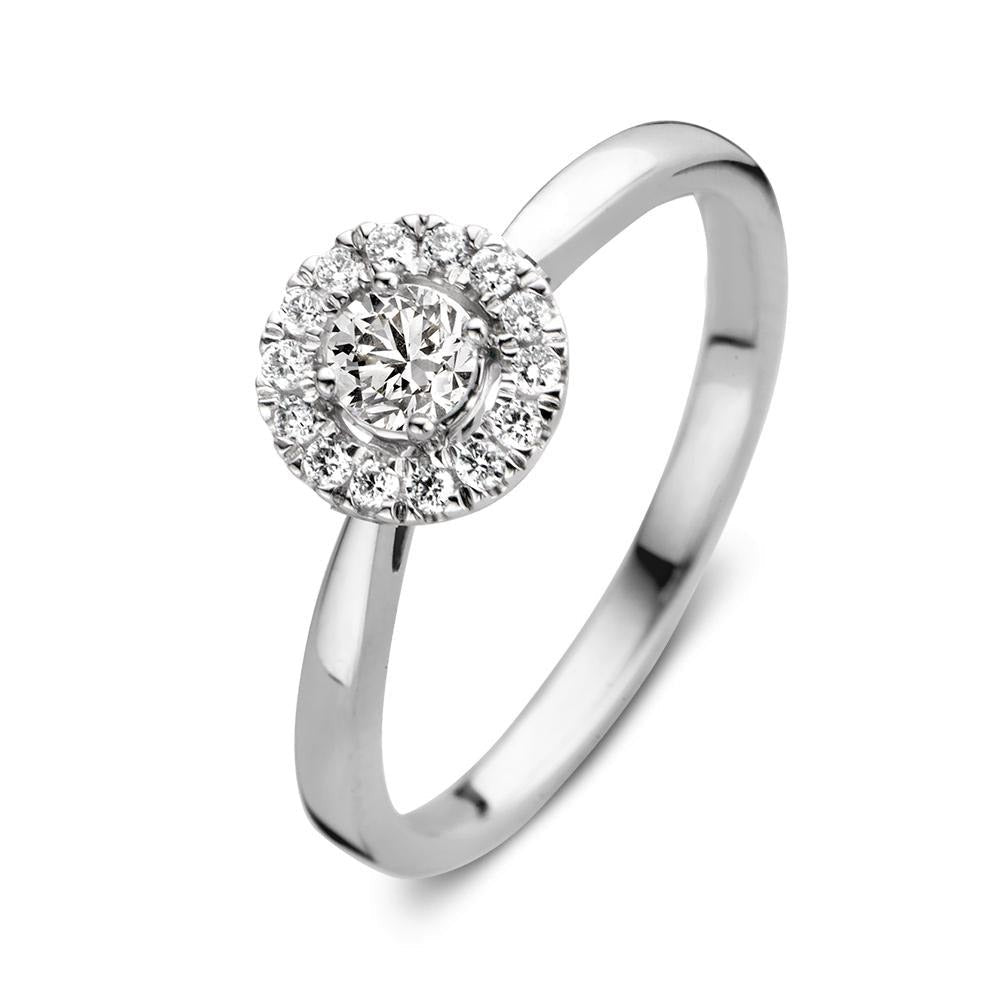 Bague en or blanc avec un motif circulaire orné de diamants brillants.