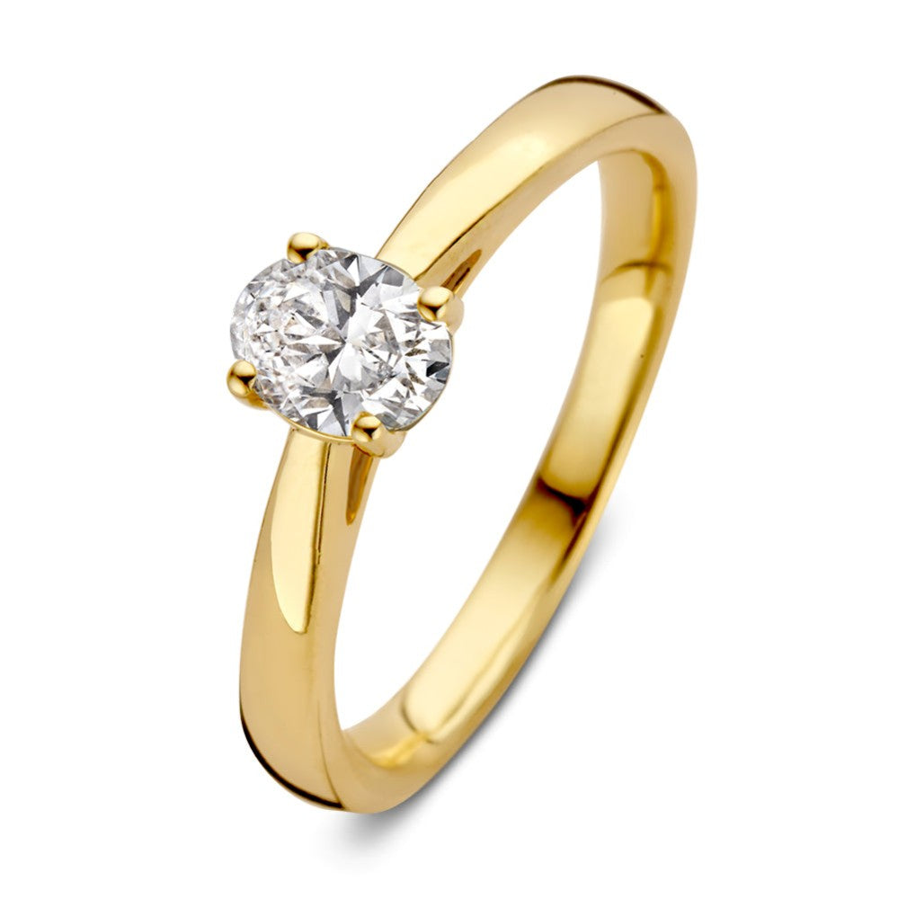 Bague en or jaune avec un diamant rond de 0,50 carat serti.