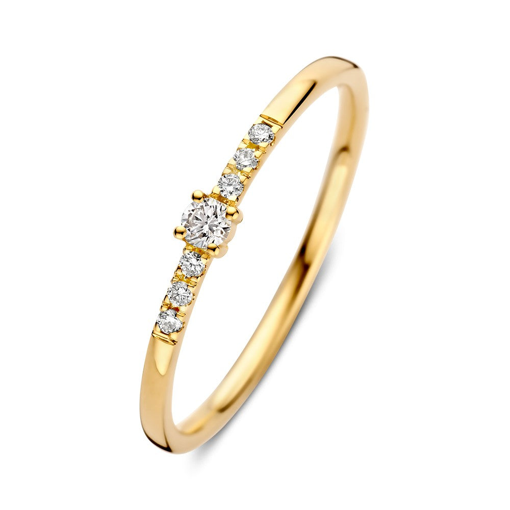 Bague en or jaune avec un brillant central de 0,09 ct et des diamants sur le côté.
