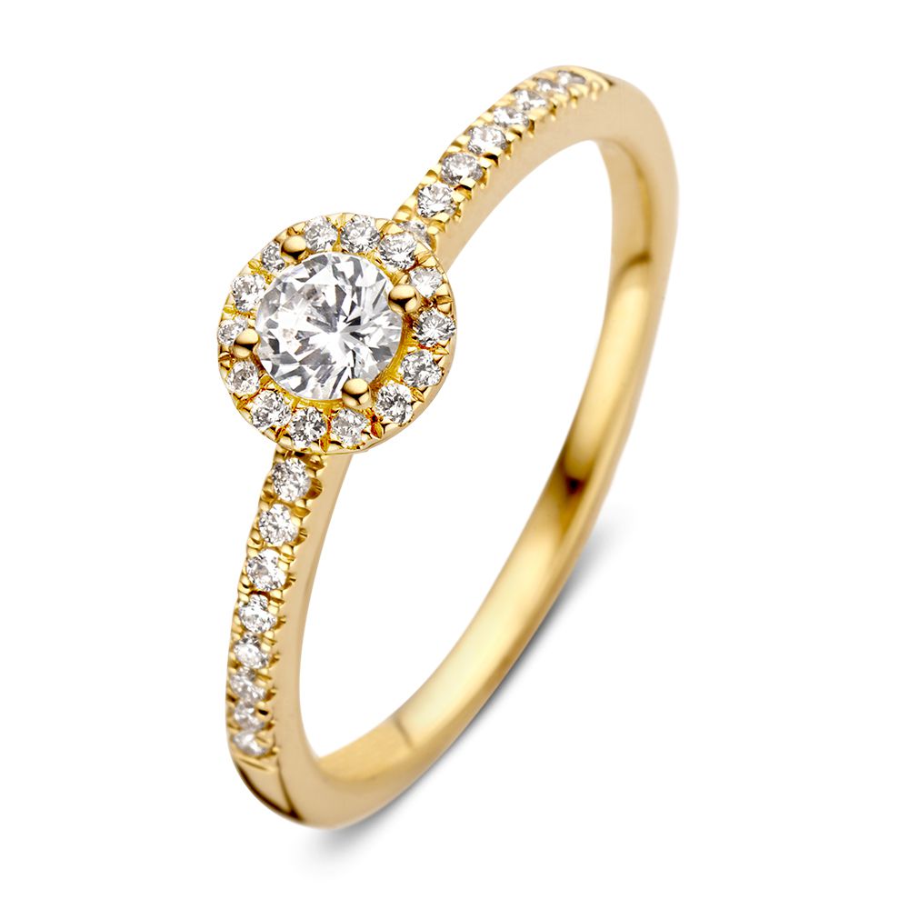Bague en or jaune élégante avec un brillant de 0,20 ct et un halo de diamants.