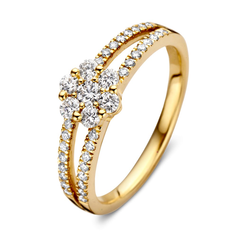 Bague en or jaune 14 carats ornée de diamants, avec un motif floral central et des pavés.
