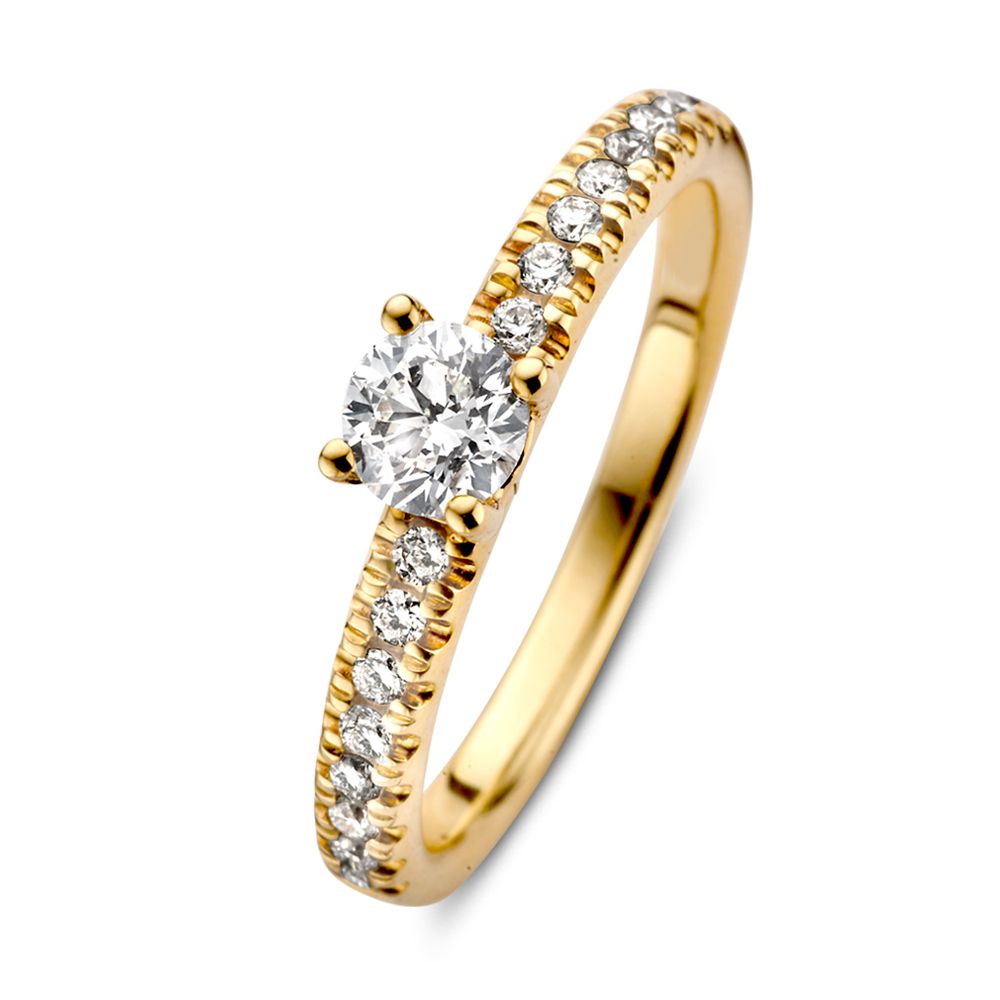 Bague en or jaune élégante avec un diamant brillant de 0,59 ct. et des diamants sur le contour.
