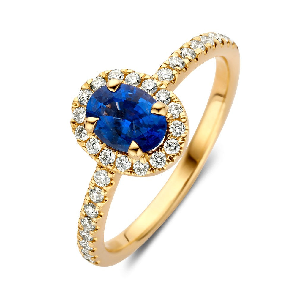 Bague en or jaune avec un saphir ovale central entouré de diamants.