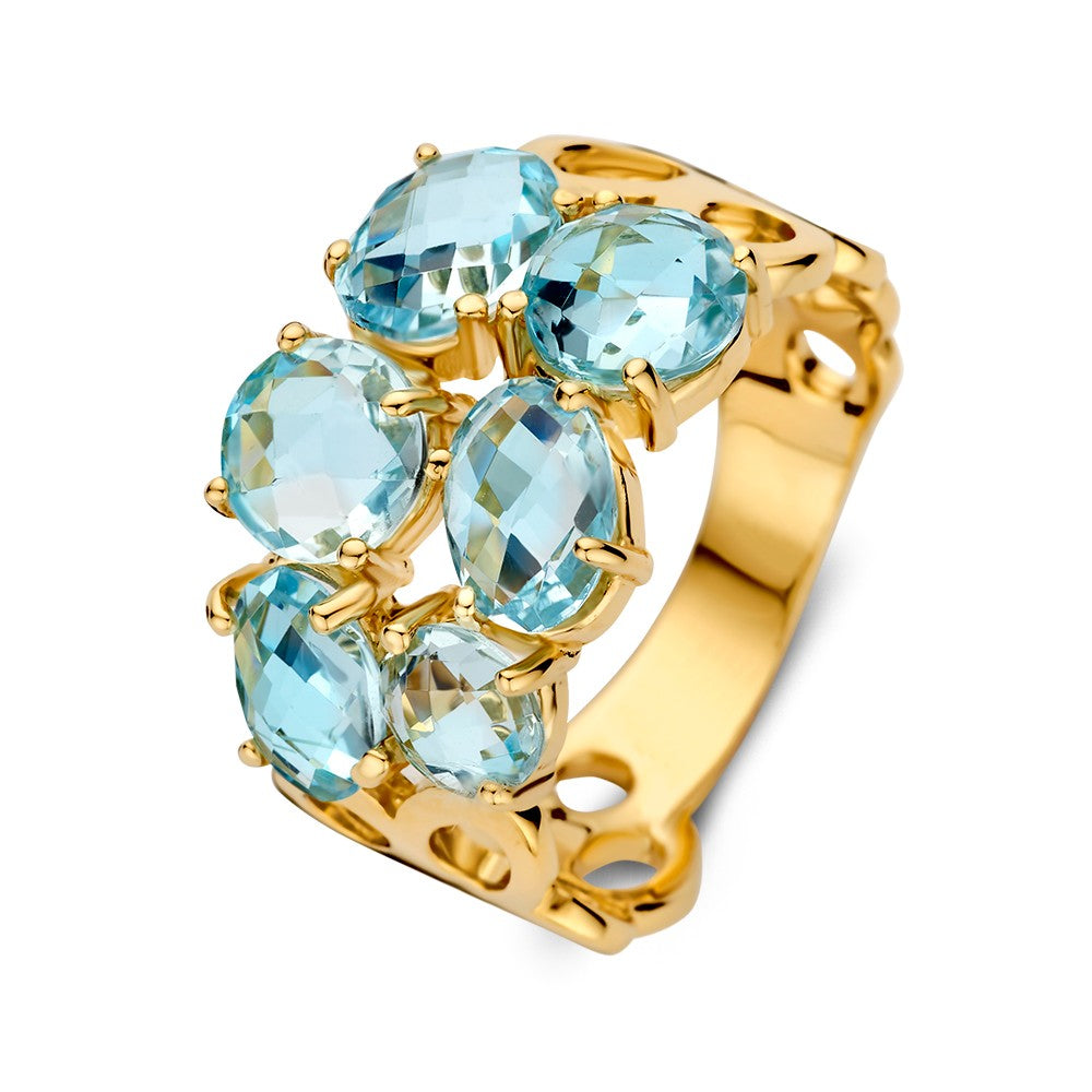 Bague en or jaune ornée de topazes bleues, design organique avec plusieurs pierres.