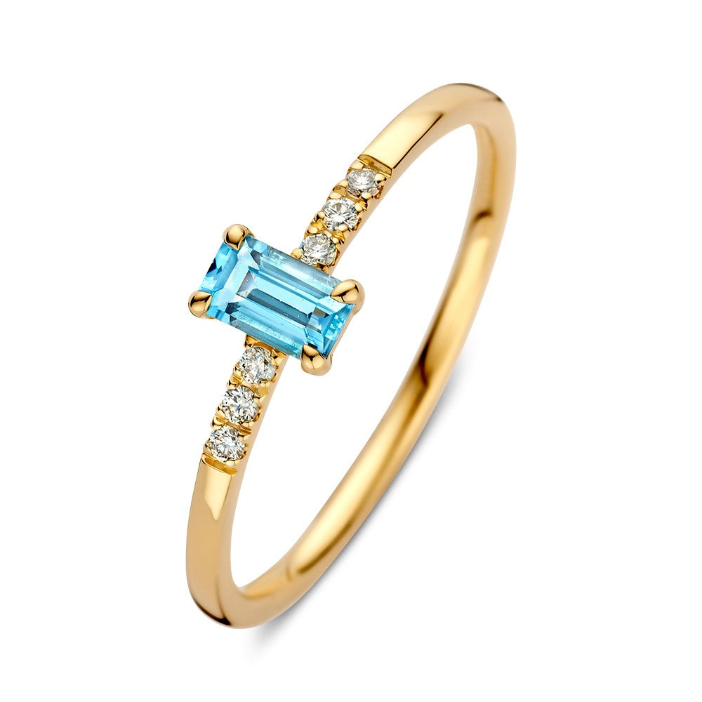 Bague en or jaune avec topaze et diamants.