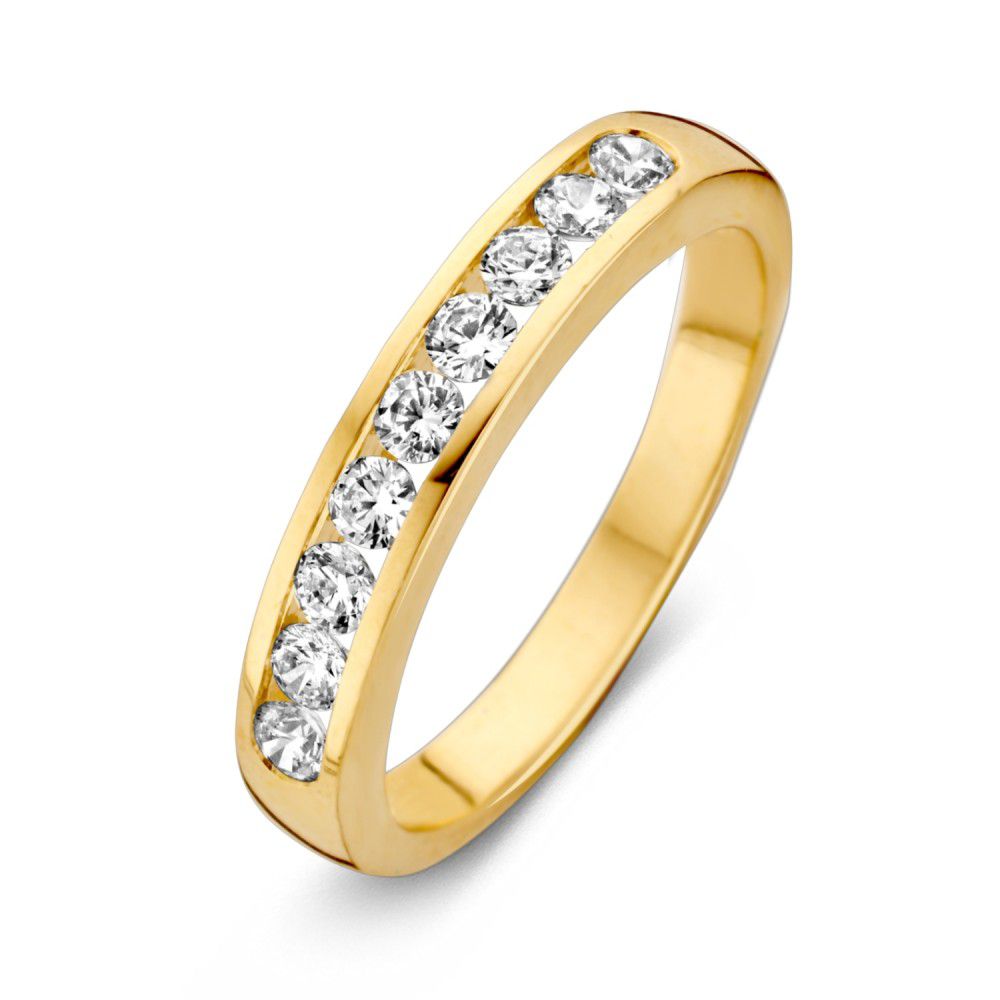 Bague en or jaune avec zircones brillantes disposées en ligne.