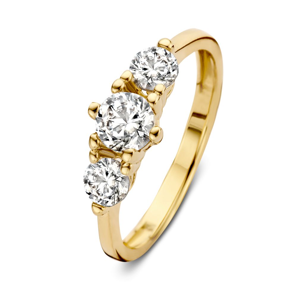 Bague en or jaune 14 carats avec trois zircons scintillants.