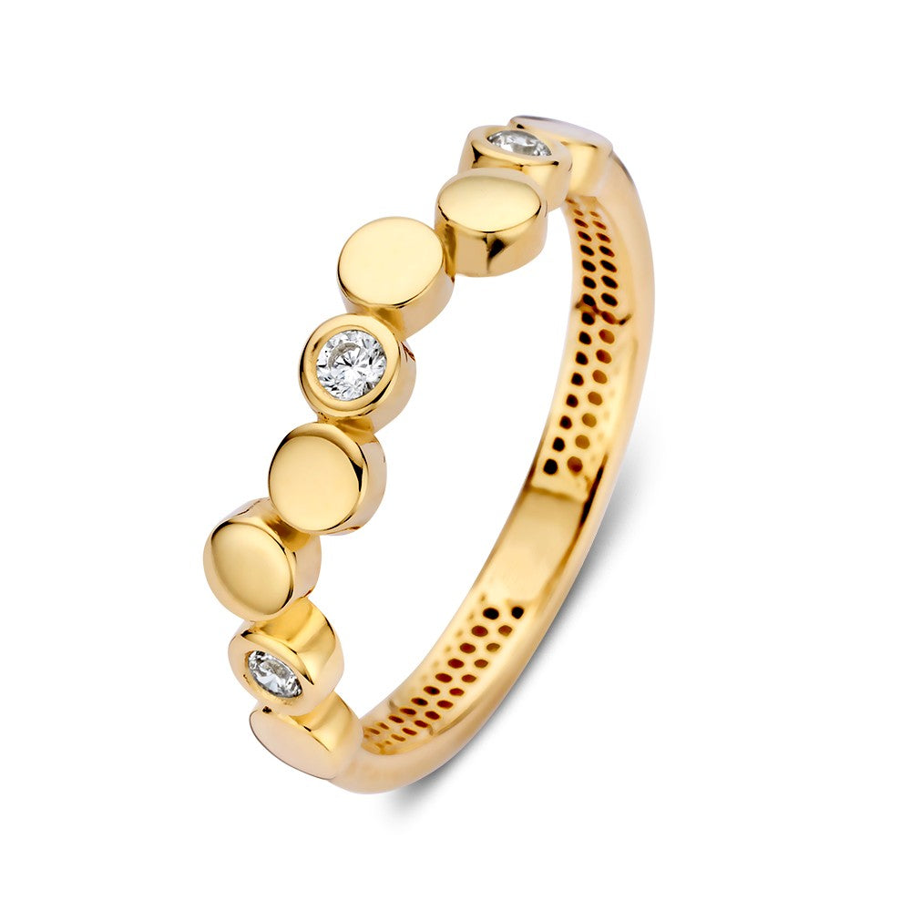 Bague en or jaune avec des éléments ronds ludiques et des zirconias scintillants.