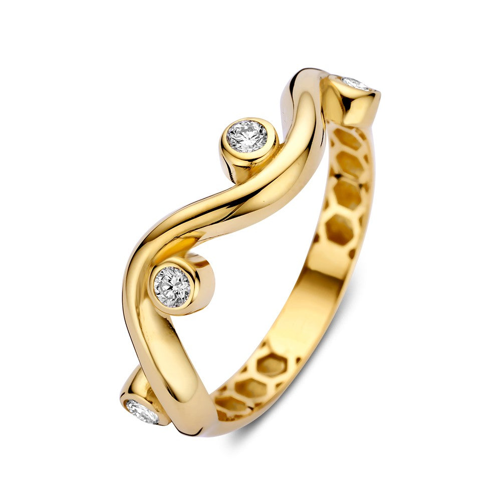 Bague en or jaune avec des zircones dans des sertissages ronds, au design ludique.