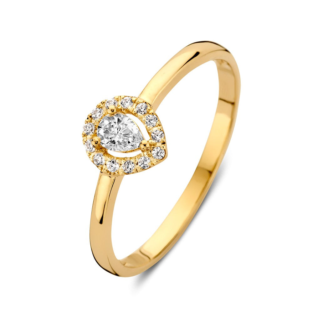 Bague en or jaune élégante avec un zircon en forme de poire entouré de zircons.