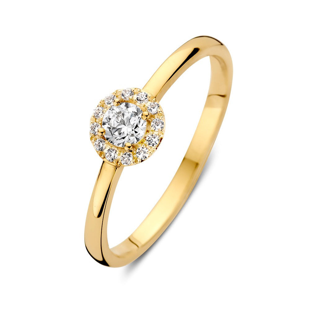 Bague en or jaune 14 carats avec un zircon central entouré de zircons.