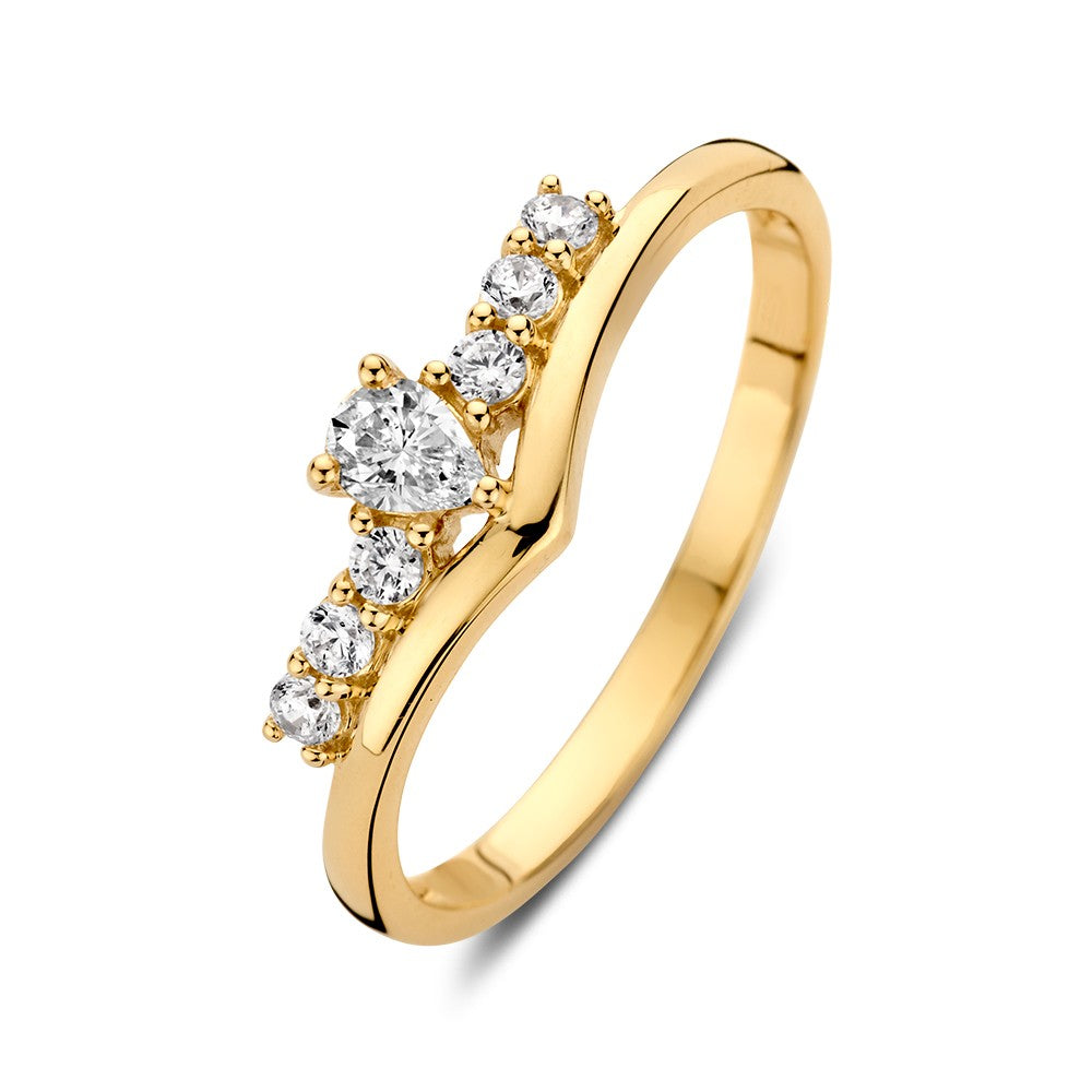 Bague en or jaune en forme de V ornée de zircons, avec un design moderne et ludique.