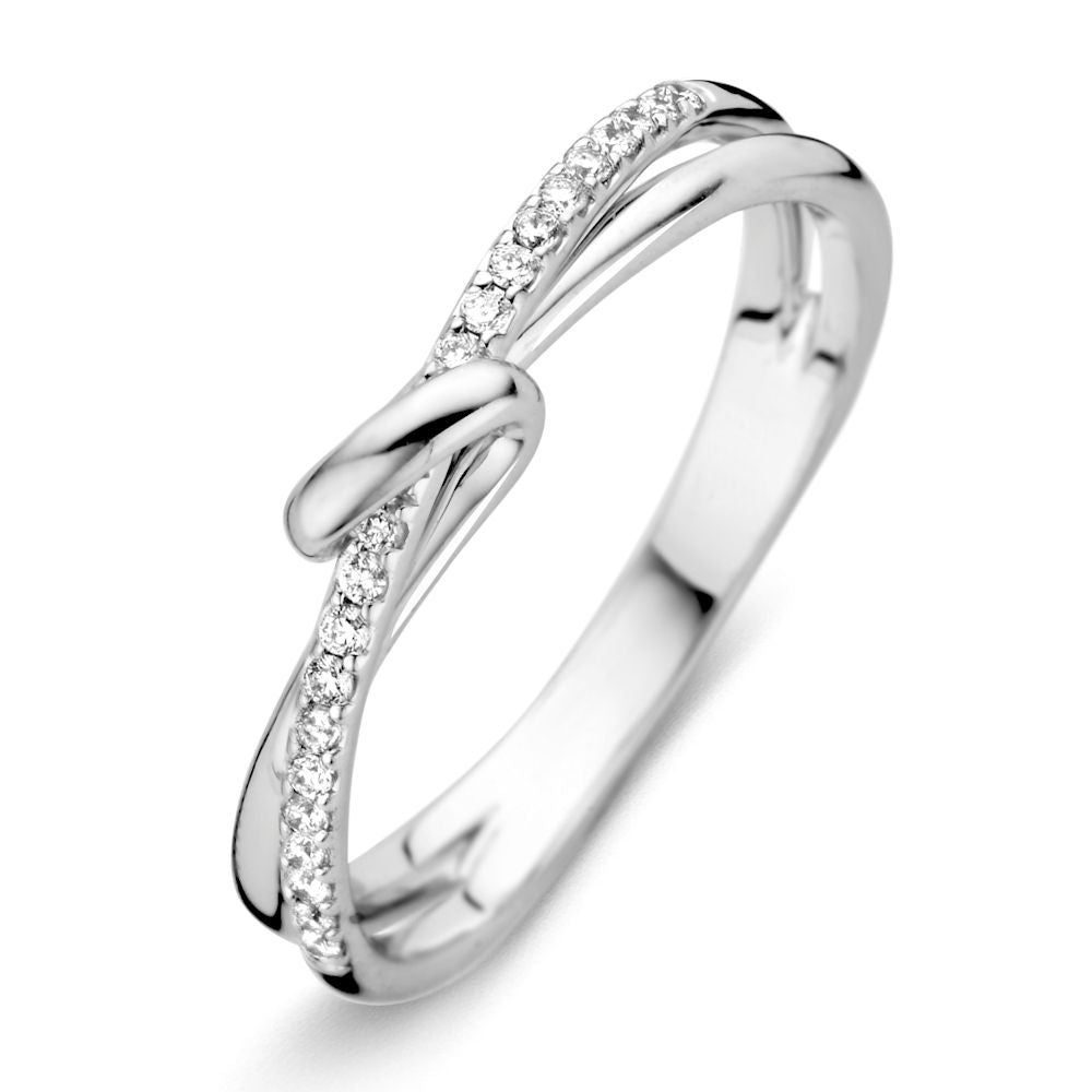 Bague en or blanc 14 carats avec un brillant de 0,12 carat, au design délicat et enroulé.