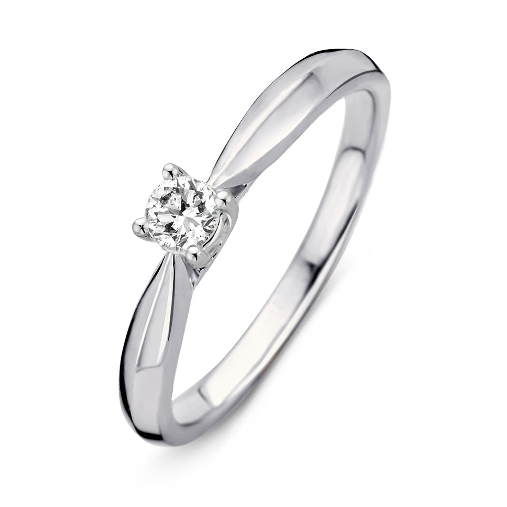 Bague en or blanc 14 carats avec un diamant brillant de 0,19 carat.