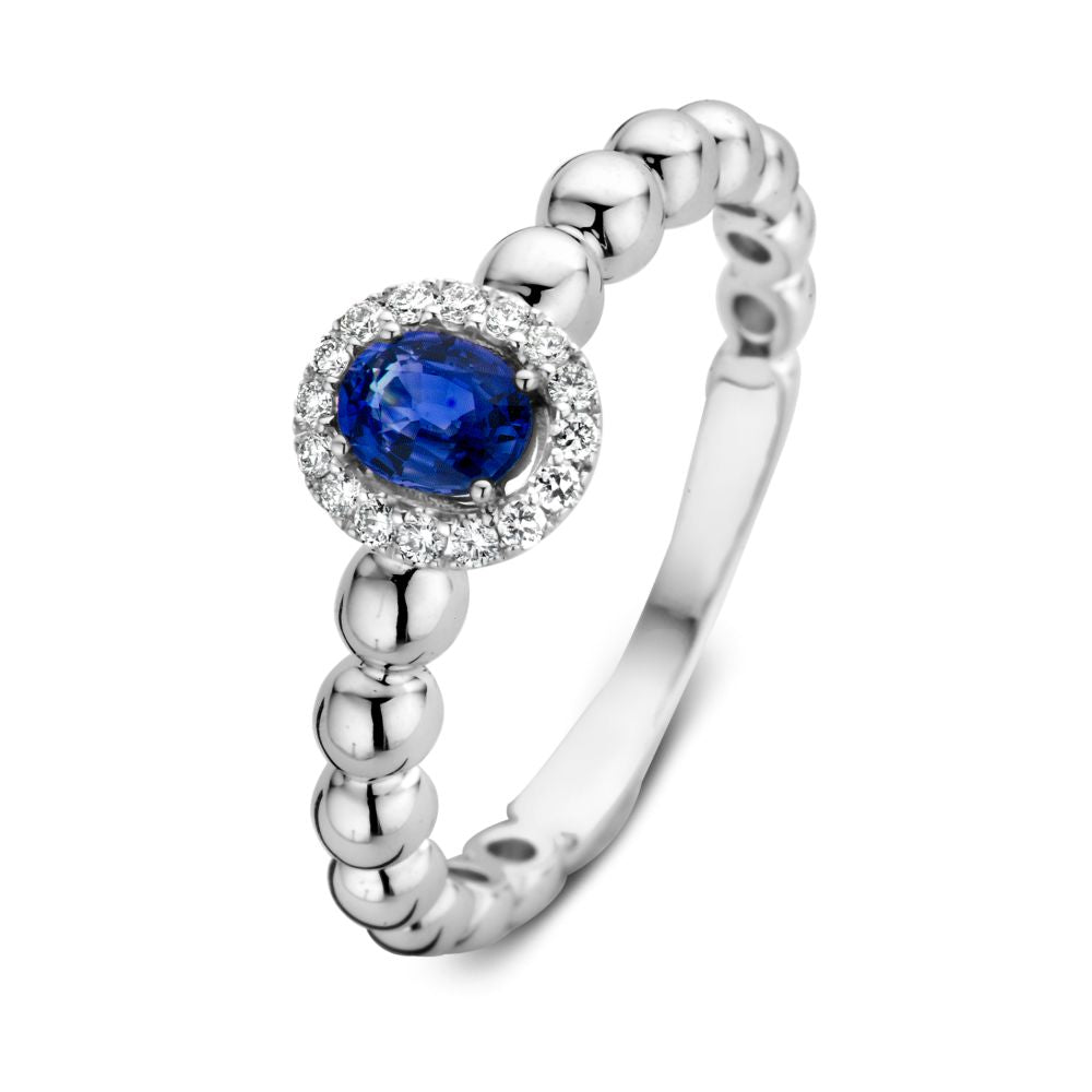 Bague en or blanc 14 carats avec saphir bleu et diamants de 0,14 carat, design à perles.