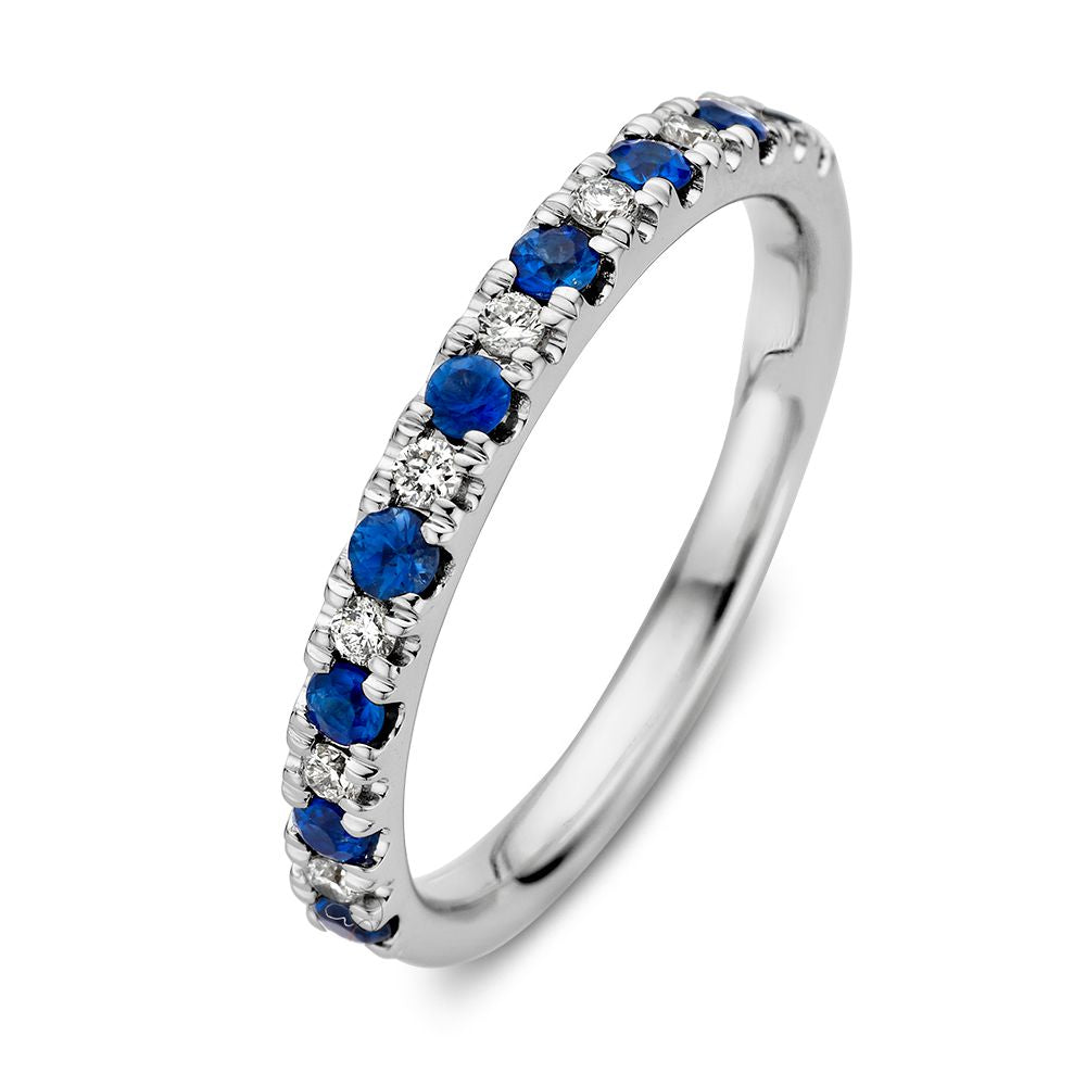 Bague en or blanc 14 carats ornée de saphirs bleus et de diamants de 0,14 carat.