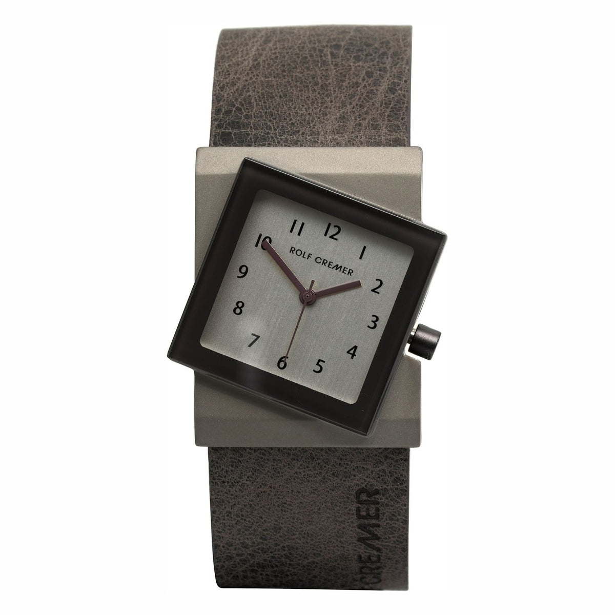 Montre carrée Rolf Cremer avec cadran argenté, bracelet en cuir brun et boîtier en acier.