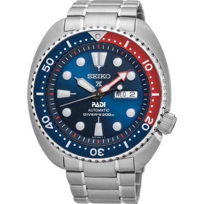 Montre Seiko Prospex Sea avec boîtier en acier inoxydable, cadran bleu, lunette rouge et bleue, bracelet métallique.