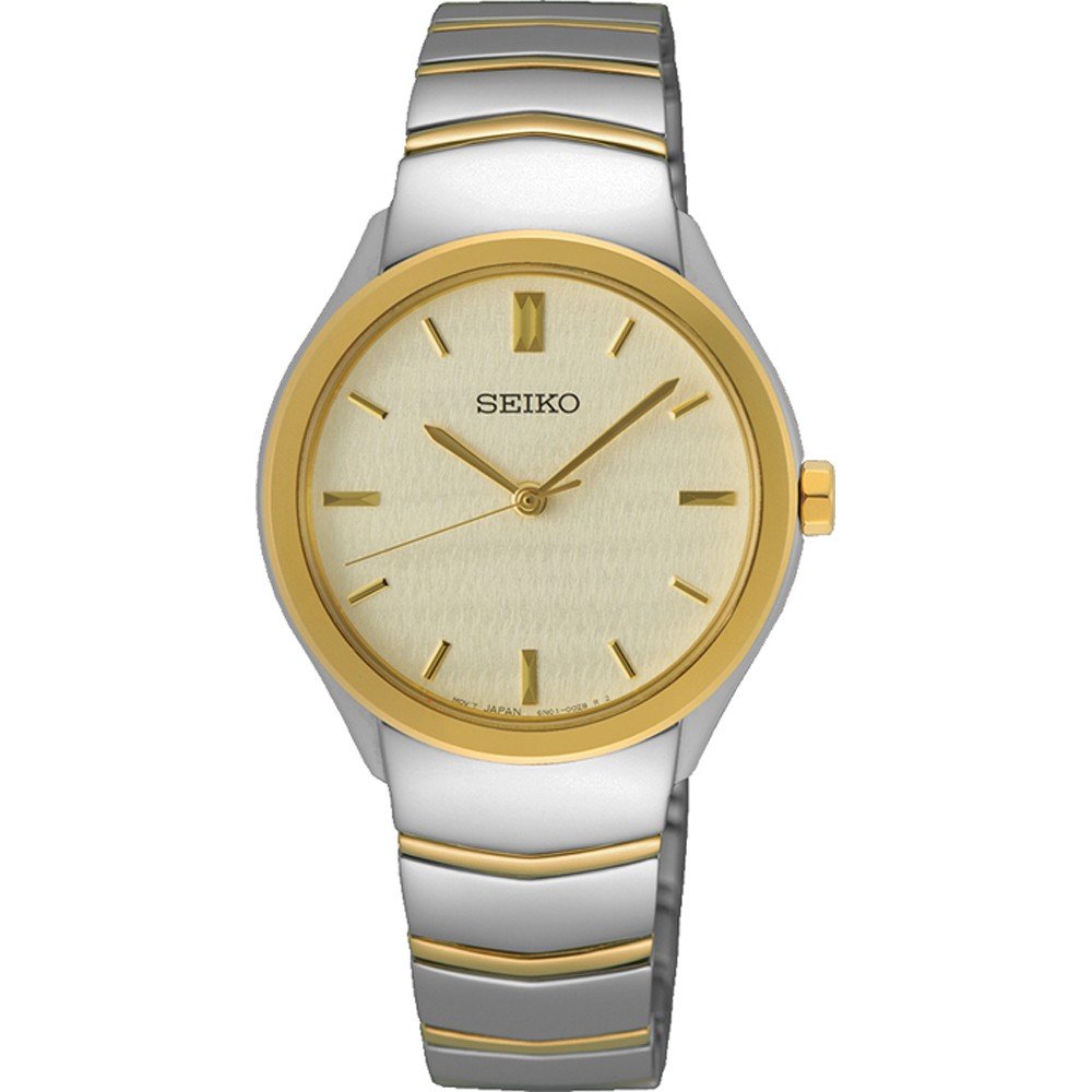 Montre femme Seiko avec boîtier argenté et doré, cadran doré et bracelet en acier inoxydable.