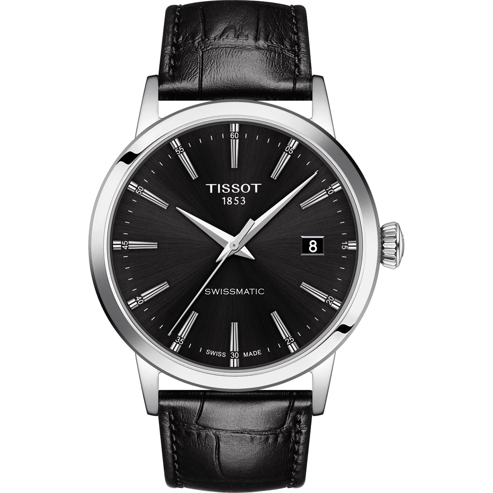 Montre Tissot Classic Dream avec cadran noir, boîtier en acier inoxydable et bracelet en cuir noir.