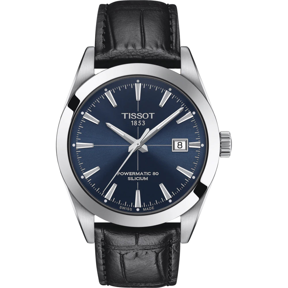 Montre Tissot avec boîtier en acier inoxydable, cadran bleu et bracelet en cuir noir.
