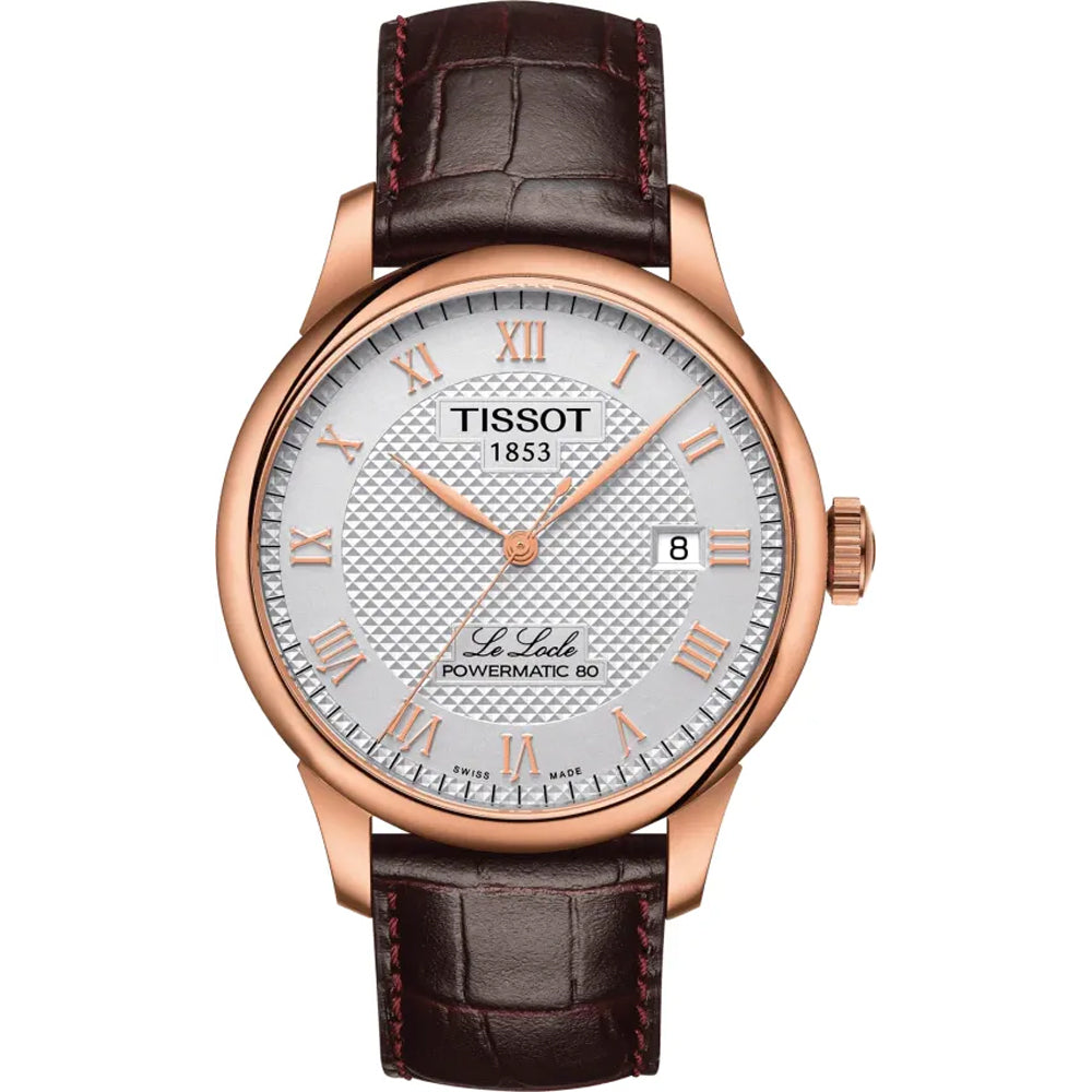 Montre Tissot Le Locle avec boîtier en acier rose, cadran argenté et bracelet en cuir marron.