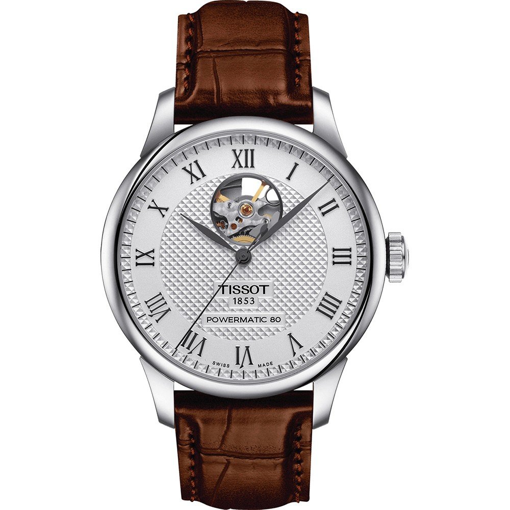 Montre Tissot Le Locle avec cadran argenté, boîtier en acier, bracelet en cuir marron et cœur ouvert.