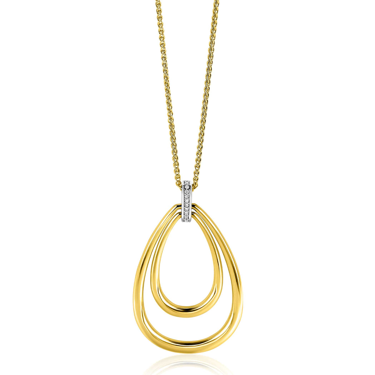 Gouden ketting met dubbele druppelvormige hanger en een kleine zilveren detail met steentjes.