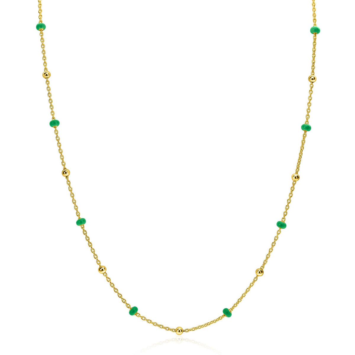 Collier doré avec des perles vertes et des billes dorées.