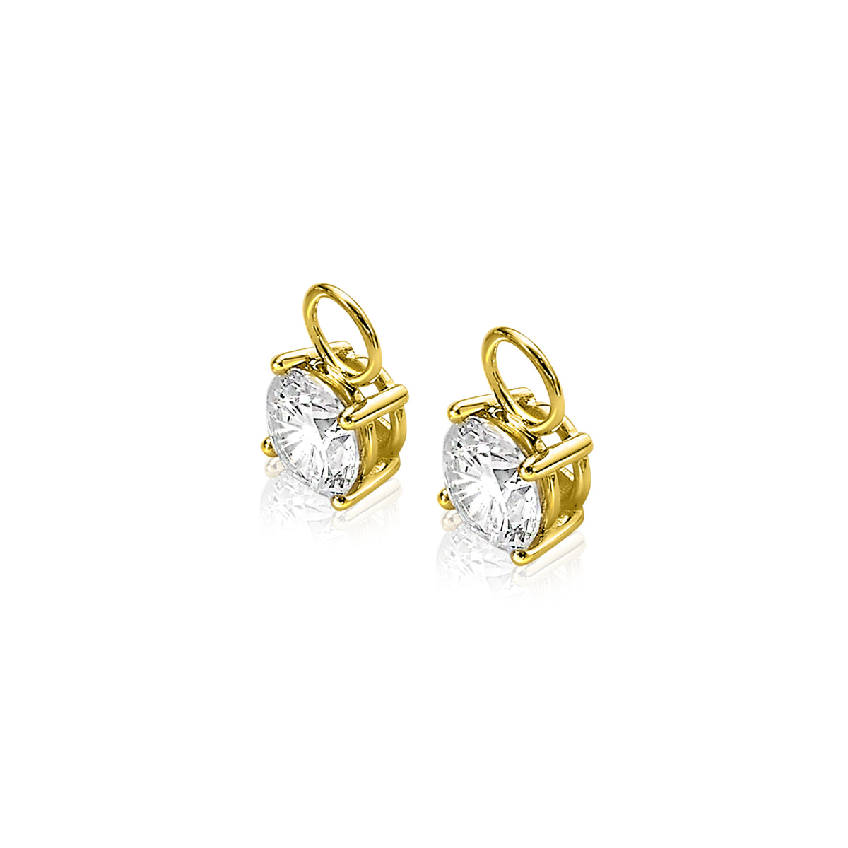 Boucles d'oreilles en or avec pierres brillantes en forme de cœur.