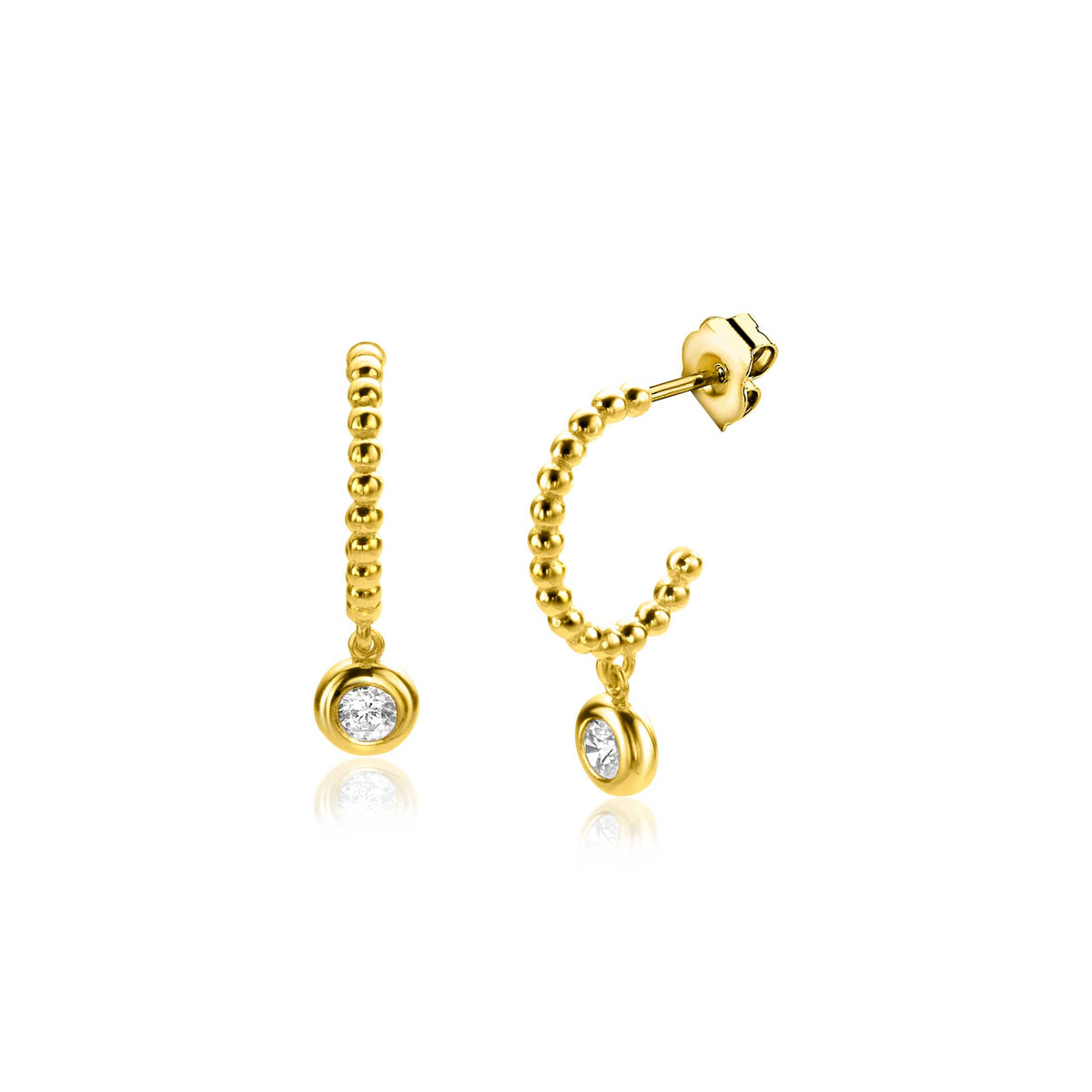 Boucles d'oreilles en or avec un petit diamant, forme circulaire et design délicat.