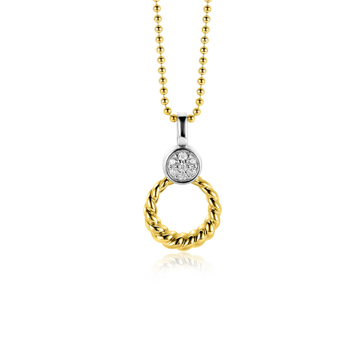 Pendentif doré en forme de cercle tressé avec un détail en argent et un zircon.