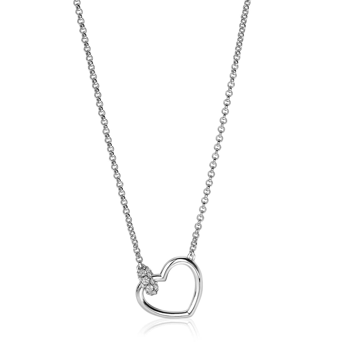Collier en argent avec un pendentif en forme de cœur et des pierres brillantes.