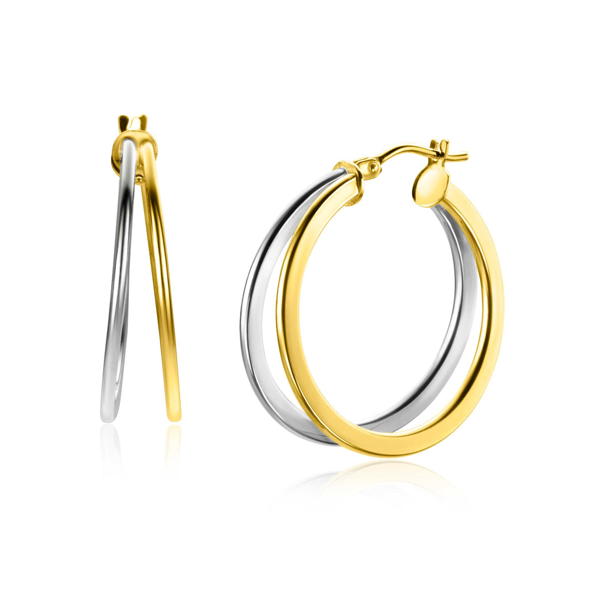 Boucles d'oreilles en or et argent, créoles avec une finition brillante et un design élégant.