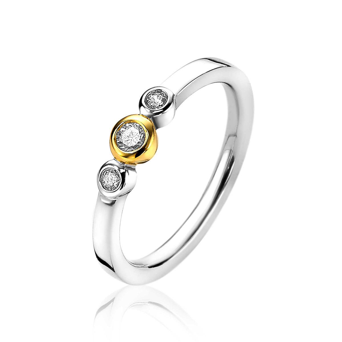 Bague en argent avec trois pierres brillantes, dont une dorée au centre.