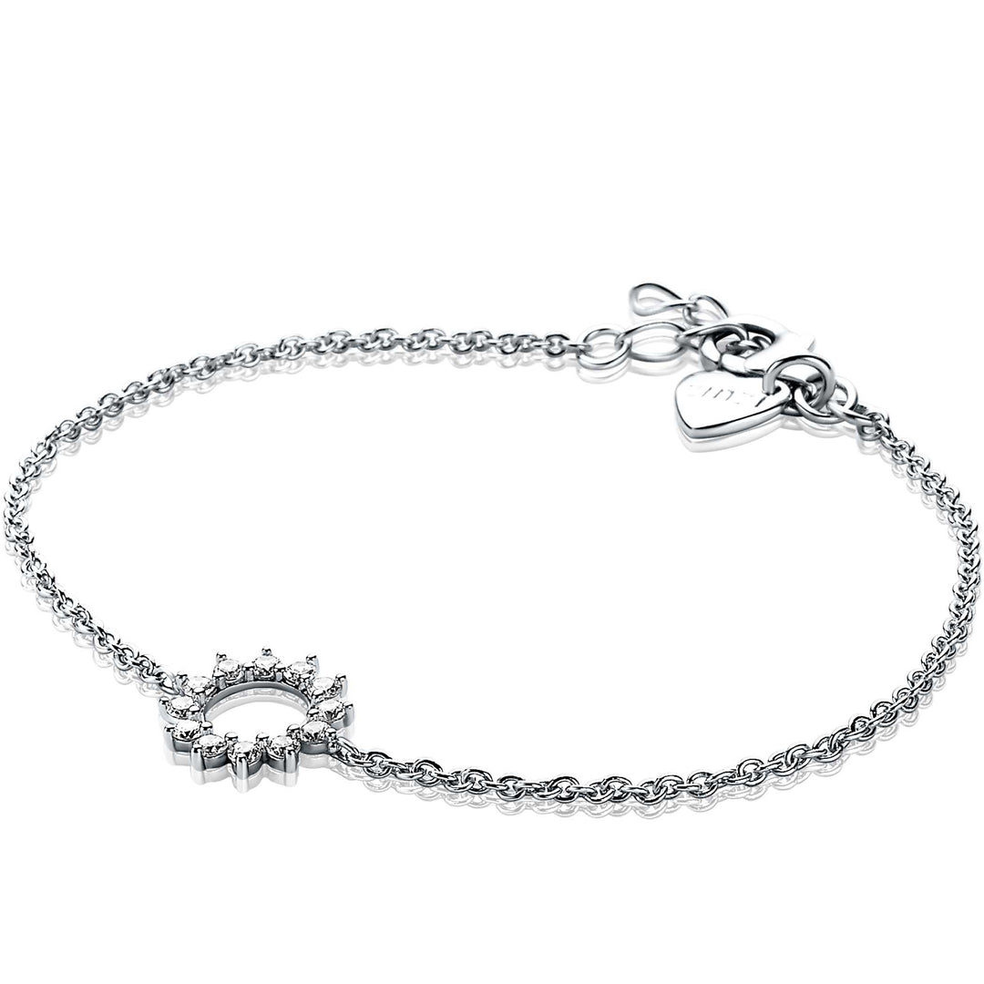 De Zinzi Armband Zilver Zia1883 van Zinzi heeft een delicate zilveren ketting met een bedel in de vorm van een zon, versierd met kleine diamantjes, een hartvormige sluiting en een verstelbare ketting voor de perfecte pasvorm.